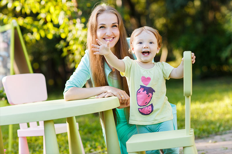 child friendly outdoor furniture smiling mother