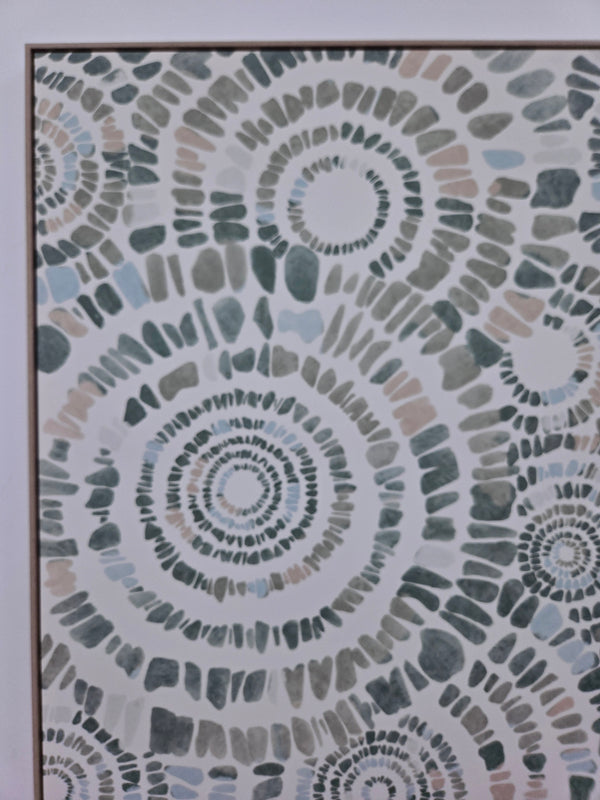 Mosaic pattern canvas print with circular designs in various shades of gray and brown.