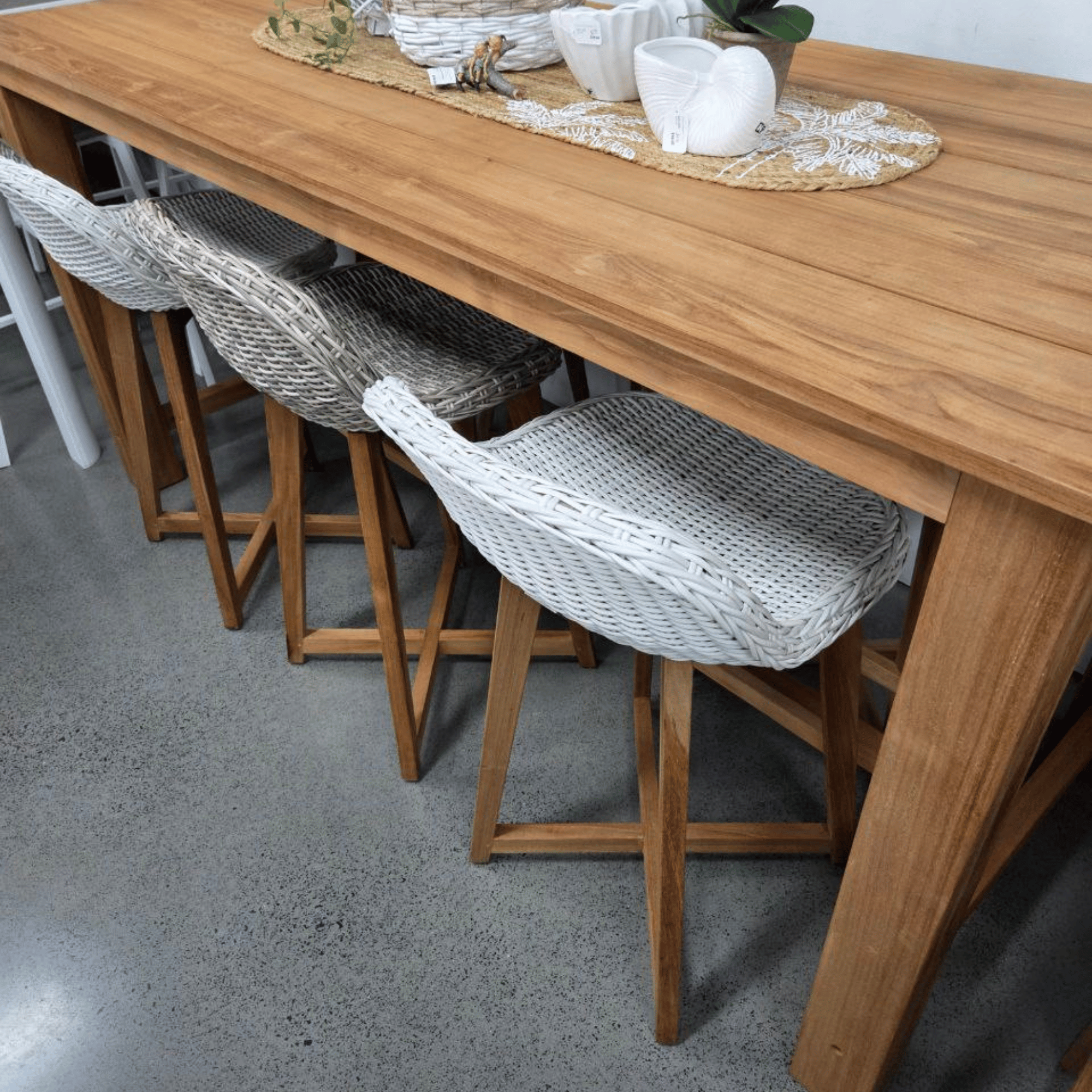 Wooden dining table with stools in a casual setting