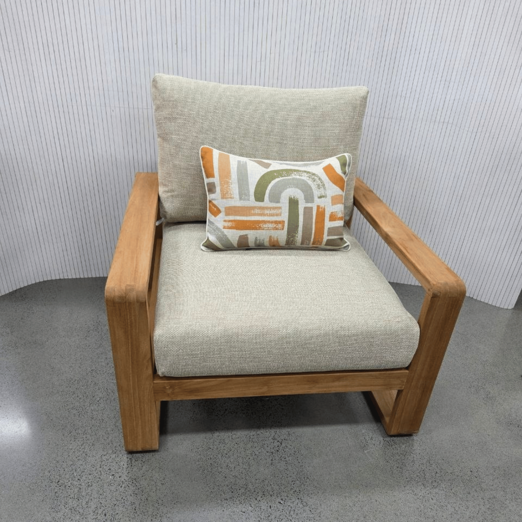 Single teak Honolulu lounge chair with beige cushions with scatter cushion