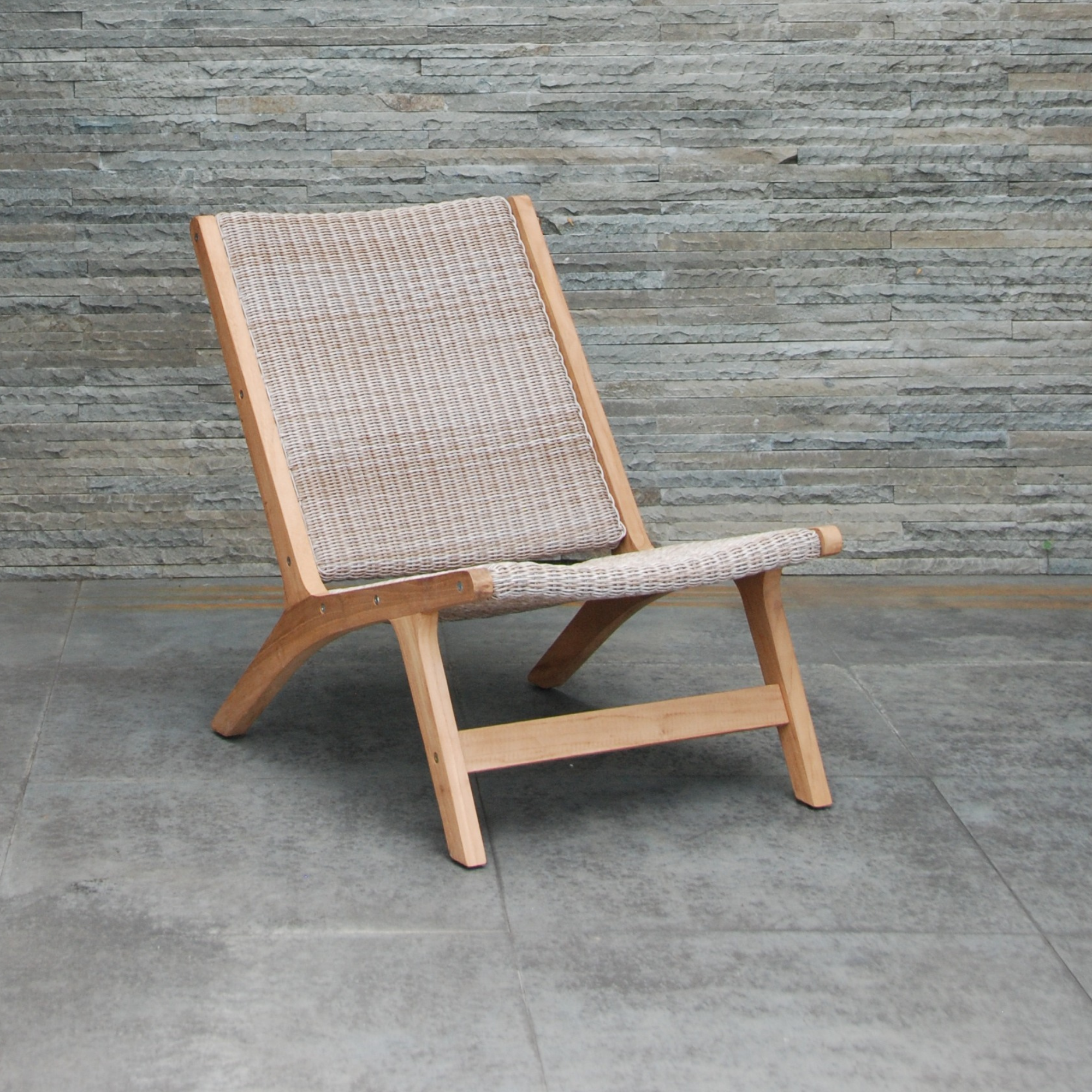 Salem teak and 'irish coffee' wicker outdoor lounge chair