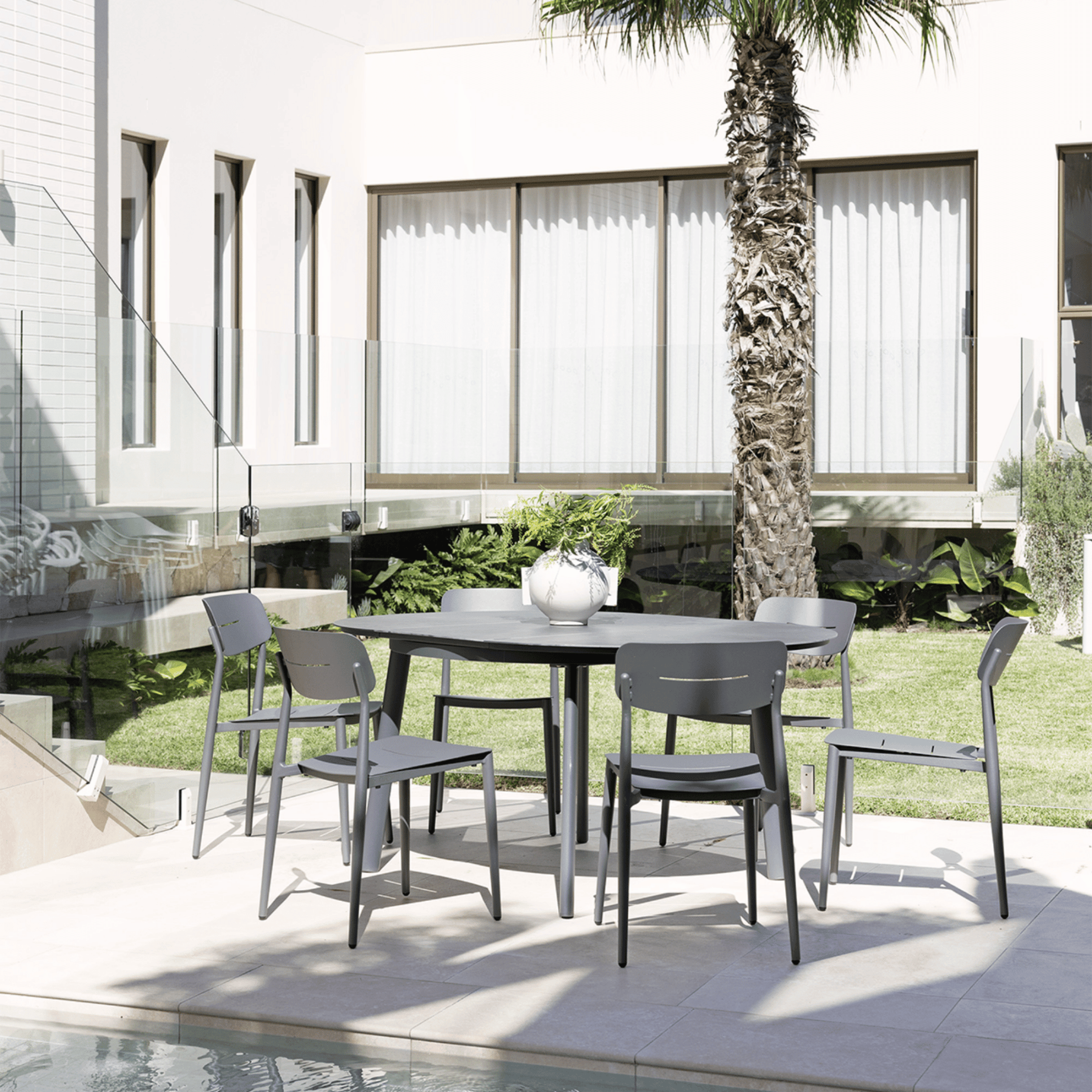 Cozy Extendable Table with Leon Chairs - 7 piece Outdoor Dining Setting - Lume Outdoor Living