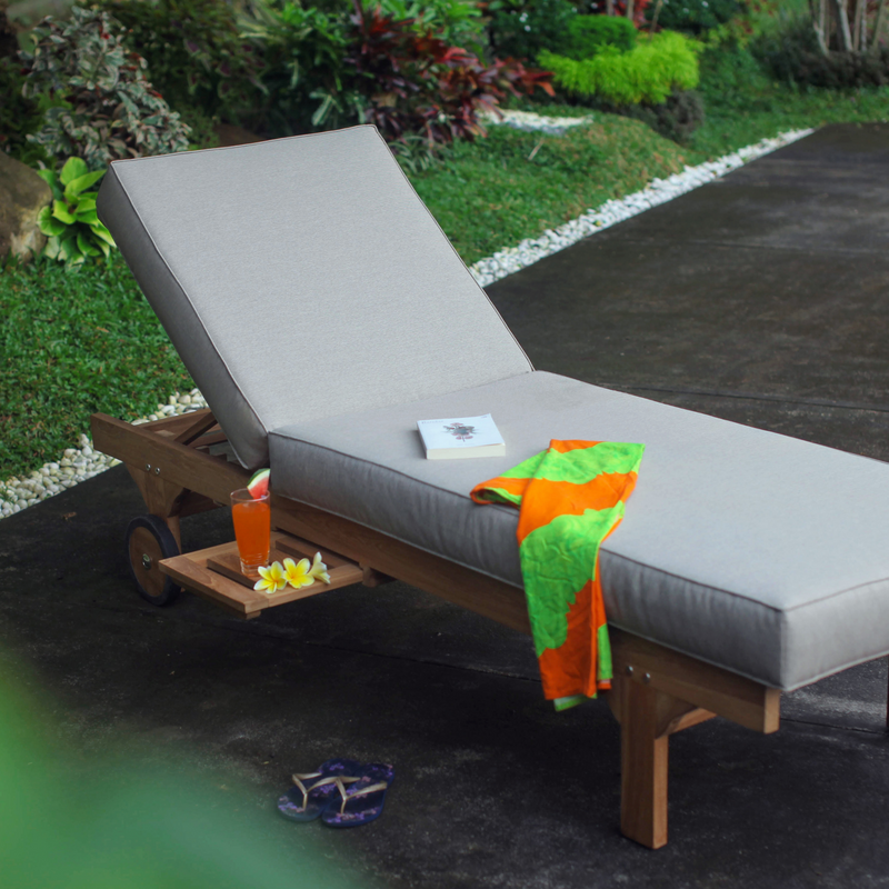 hayman lounger with towel and drinks on pull out table
