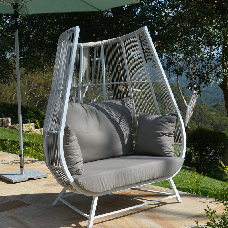 sunset wicker and aluminium pod with fairview umbrella and granite base on sandstone tiles